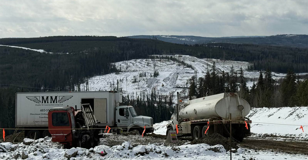 A Double M Construction crew sets up for a remote pipeline utility project in the snow.